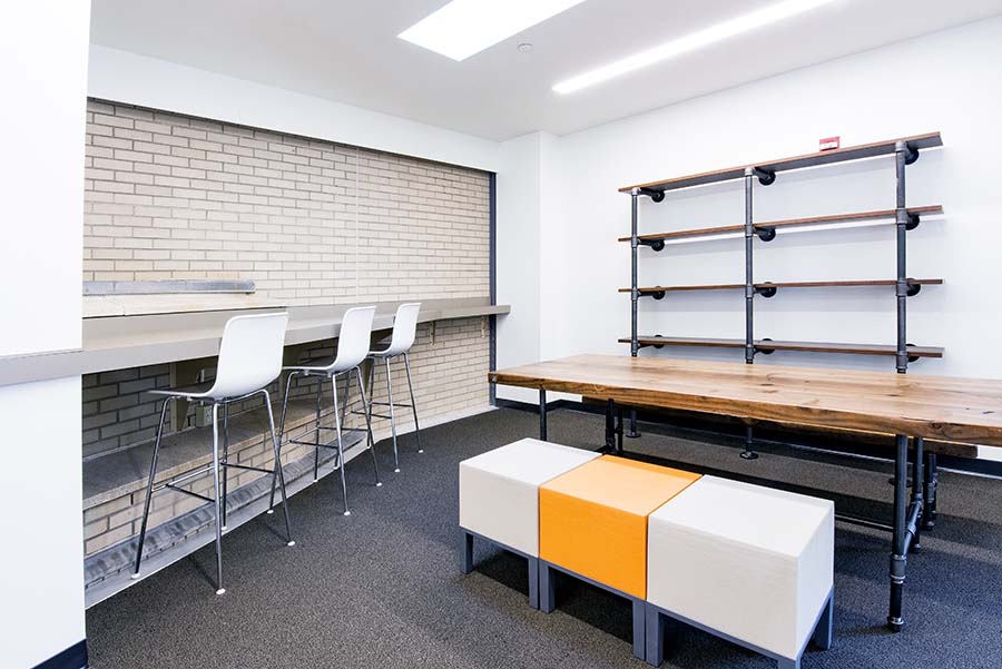 Photo of the Graduate Student Lounge showing a communal workspace